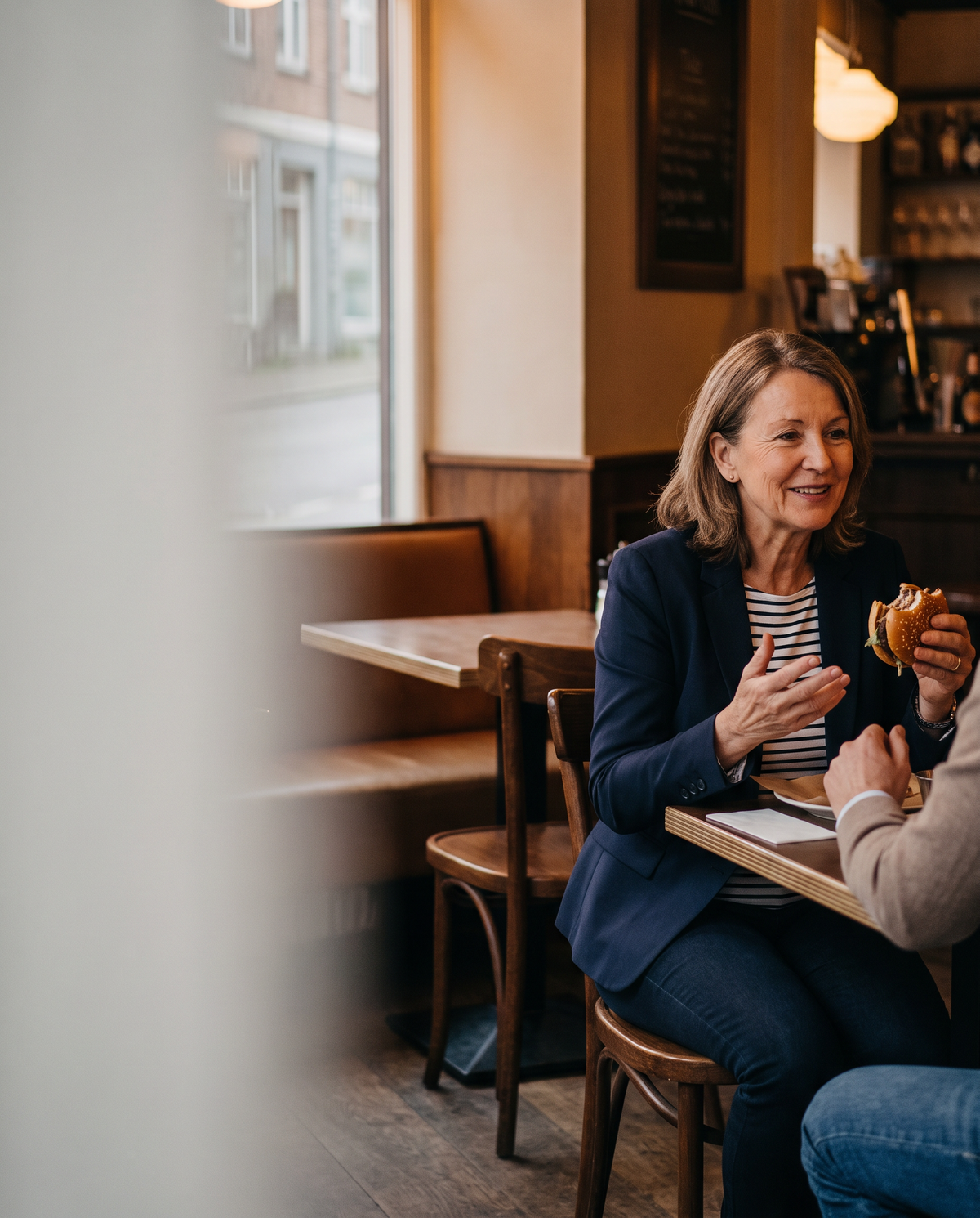 Woman eating out with friends, relaxed and comfortable